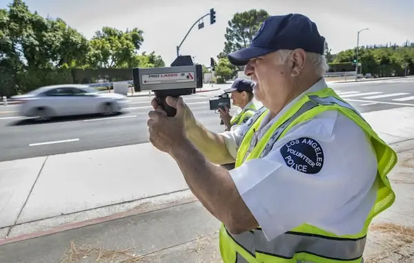 police holding speed gun